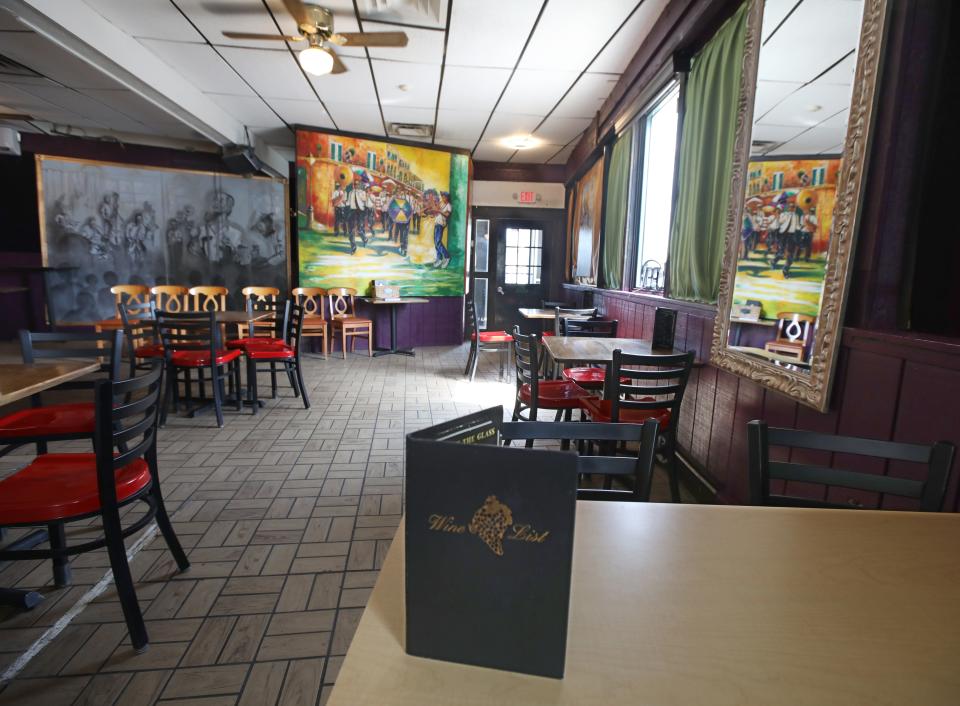 Colorful murals and paintings cover the wall in the main front dining room at the French Quarter in Rochester Thursday, Aug. 10, 2023. 