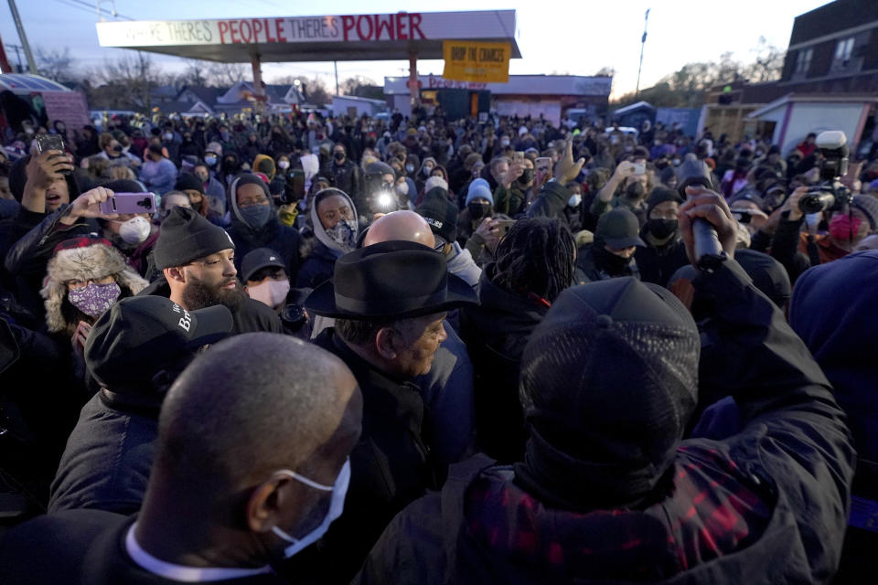 The Rev. Jesse Jackson, center, walks with his security detail at George Floyd Square after a guilty verdict was announced at the trial of former Minneapolis police Officer Derek Chauvin for the 2020 death of Floyd, Tuesday, April 20, 2021, in Minneapolis. Chauvin has been convicted of murder and manslaughter in Floyd's death. (AP Photo/Julio Cortez)