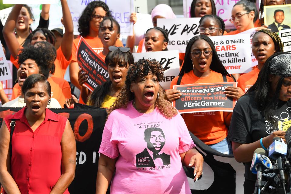 Eric Garner's mother, Gwen Carr, in pink, protests in Foley Square in New York with others on July 17, 2019.

