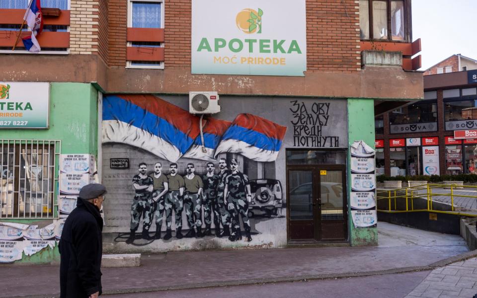 The northern, Serb controlled district of Mitrovica, adorned with Serbian flags and nationalist graffiti - Heathcliff O'Malley