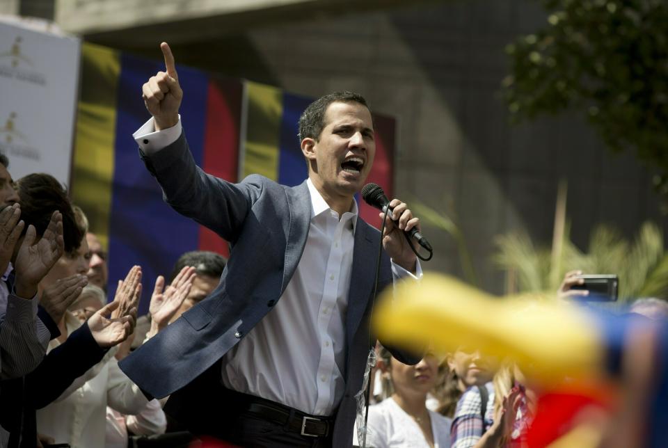 In this Jan. 11, 2019 photo, Juan Guaido, President of the Venezuelan National Assembly delivers a speech during a public session with opposition members, at a street in Caracas, Venezuela. The head of Venezuela's opposition-run congress says that with the nation's backing he's ready to take on Nicolas Maduro's presidential powers and call new elections.(AP Photo/Fernando Llano)