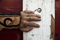 <p>The tattooed fingers of Spanish bullfighter “El Tatu” as he waits for the start of a bullfight in the village of Penafiel, Aug. 15, 2013. (Photo: Daniel Ochoa de Olza/AP) </p>