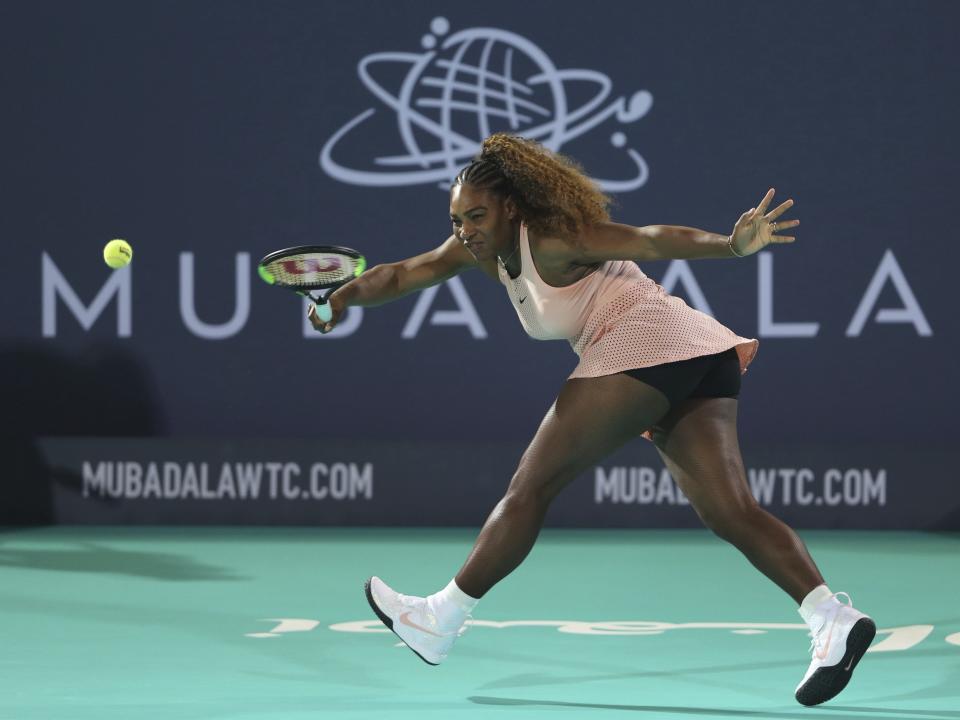 Serena Williams returns the ball to her sister Venus during a match at the opening day of the Mubadala World Tennis Championship in Abu Dhabi, United Arab Emirates on Dec. 27.&nbsp; (Photo: ASSOCIATED PRESS)