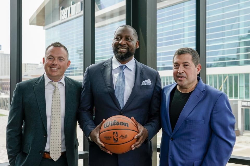 Milwaukee Bucks general manager Jon Horst, left, poses for a picture with new head coach Adrian Griffin, center, and President Peter Feigin at a news conference Tuesday, June 6, 2023, in Milwaukee. (AP Photo/Morry Gash)