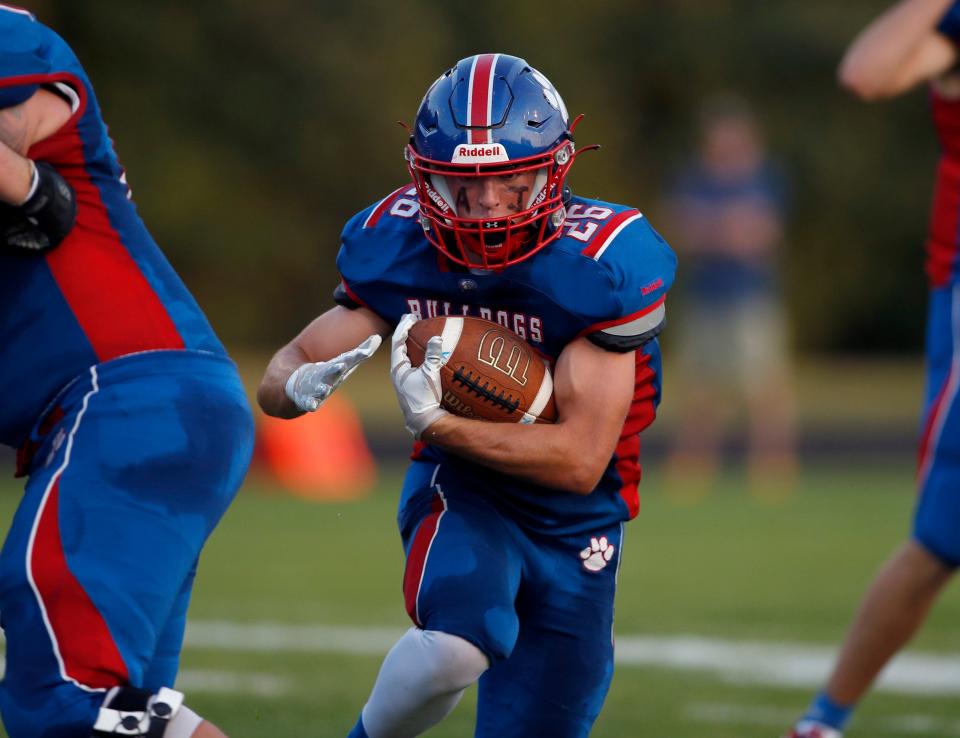 Mason's AJ Martel runs for a touchdown against Haslett, Friday, Sept. 22, 2023, in Mason.