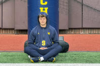 FILE - Michigan quarterback J.J. McCarthy sits on the field with his back against a padded goalpost on Nov. 4, 2023 in Ann Arbor, Mich. McCarthy meditates roughly two hours before games. McCarthy is a possible first round pick in the NFL Draft.(AP Photo/Larry Lage, File)