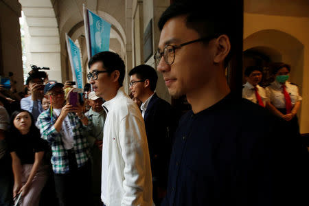 Pro-democracy activists Alex Chow, Joshua Wong and Nathan Law walk out of the Court of Final Appeal in Hong Kong, China November 7, 2017. REUTERS/Bobby Yip