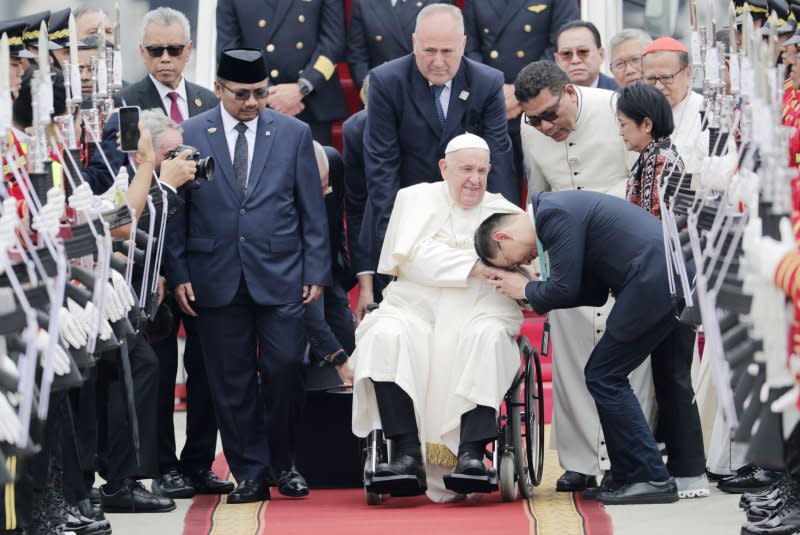 Pope Francis is welcomed during his arrival at Soekarno-Hatta International Airport in Tangerang, Banten, on the outskirts of Jakarta, Indonesia, Tuesday. The pontiff also visited Papua New Guinea and will end his tour with a stop in Singapore. Photo by Bagus Indahono/EPA-EFE