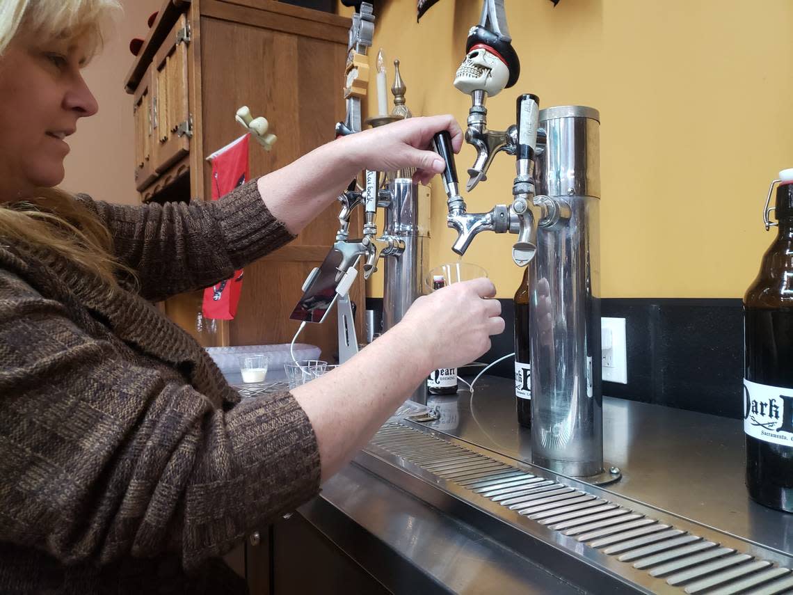DarkHeart co-founder Cynthia Lee pours a beer at the quirky Sacramento Brewery.