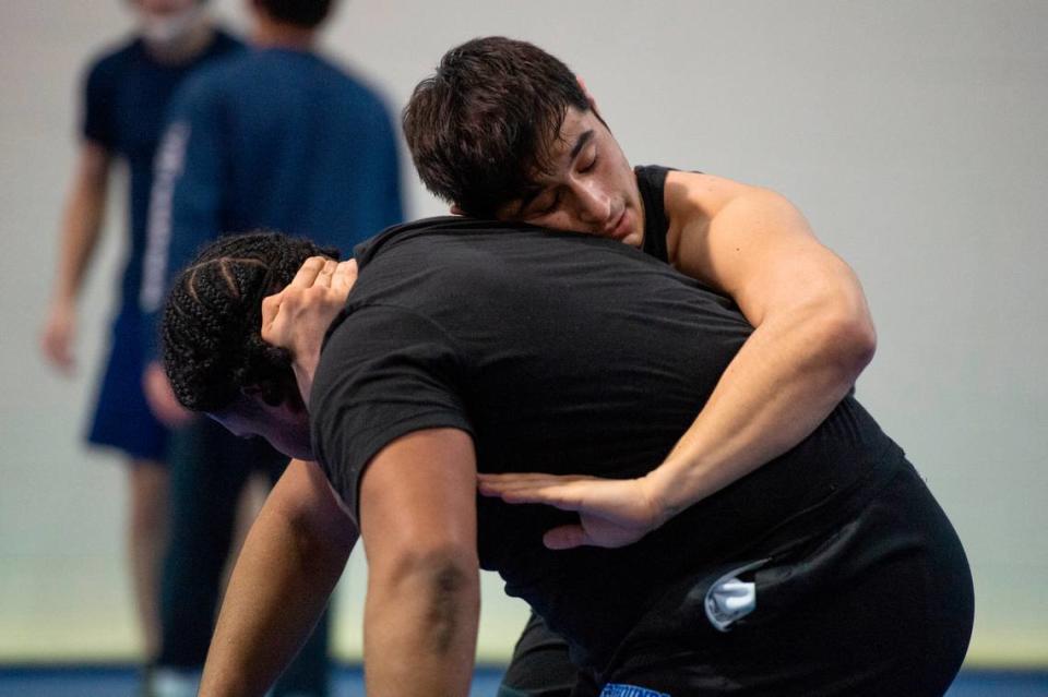 Xavier Smith and Trent Schlosberg practice wrestling moves on each other during Ocean Springs’ high school wrestling practice at E.H. Keys Alternative Education Center on Thursday, Feb. 8, 2024.