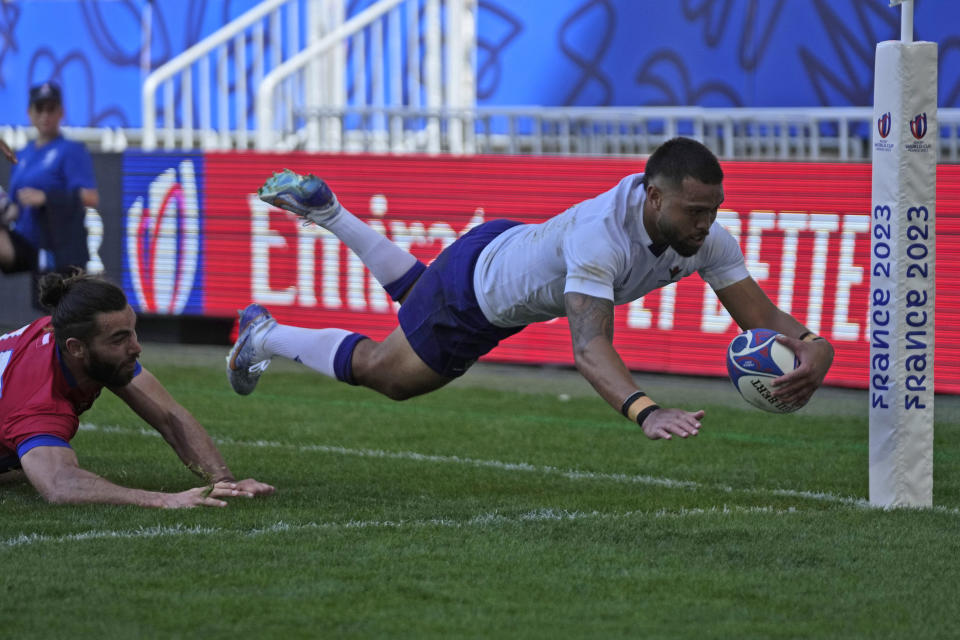 Samoa's Duncan Paia'aua scores a try as Chile's Inaki Ayarza arrives too late to tackle during the Rugby World Cup Pool D match between Samoa and Chile at the Stade de Bordeaux in Bordeaux, France, Saturday, Sept. 16, 2023. (AP Photo/Themba Hadebe)