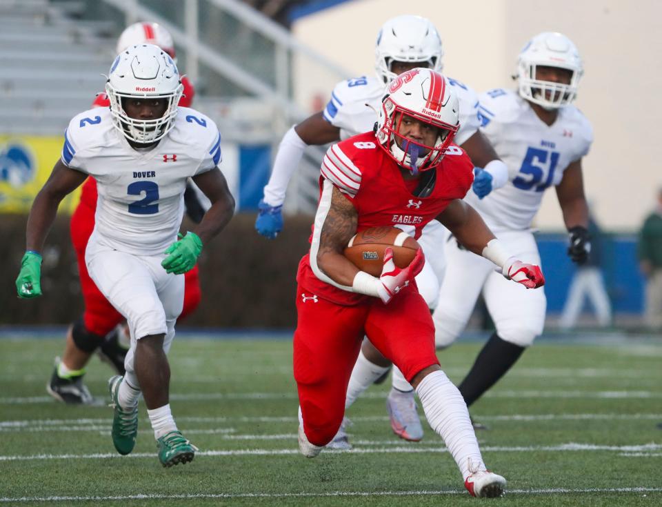 Smyrna's Yamir Knight picks up a long gain in the second quarter of the DIAA Class 3A championship at Delaware Stadium, Saturday, Dec. 10, 2022.