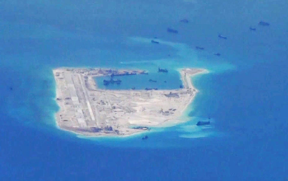 Image: File photo from a United States Navy video purportedly shows Chinese dredging vessels in the waters around Fiery Cross Reef in the disputed Spratly Islands (U.S. Navy via Reuters)