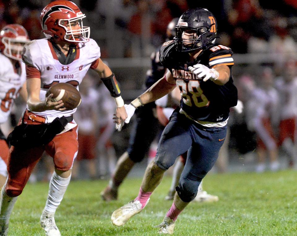 Rochester's Lance Ingold, right, goes after Glenwood's quarterback during the game Friday, Oct. 13, 2023.