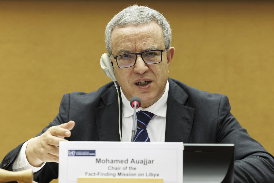 Mohamed Auajjar, center, Chairperson of the Independent Fact-Finding Mission on Libya, speaks to the media ahead of presenting the findings of the final report, at the 52nd session of the Human Rights Council during a press conference, at the European headquarters of the United Nations in Geneva, Switzerland, Monday, March 27, 2023. (Salvatore Di Nolfi/Keystone via AP)