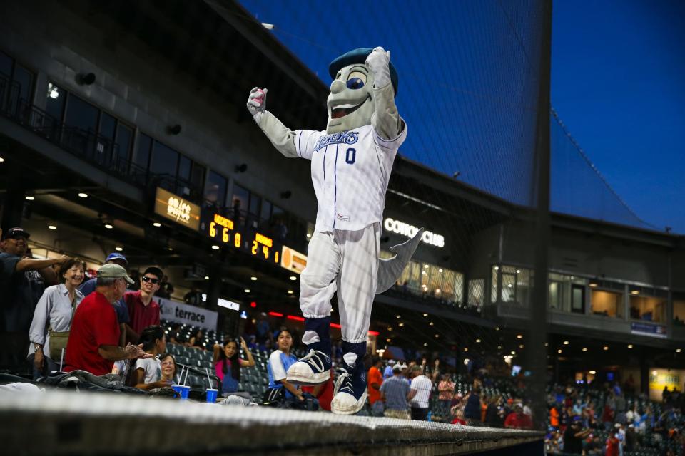 Mascot Rusty Hook hypes up the crowd for a t-shirt toss during the Hooks game against the Wind Surge on Tuesday, May 24, 2022 at Whataburger Field.