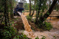 <p>Water is pumped out of Tham Luang Nang Non Cave into a lake on the foot of Doi Nang Non mountain range on June 30, 2018, in Chiang Rai Province, Thailand, after monsoon rains blocked the main entrance, trapping a youth soccer team and their coach. (Photo: Linh Pham/Getty Images) </p>