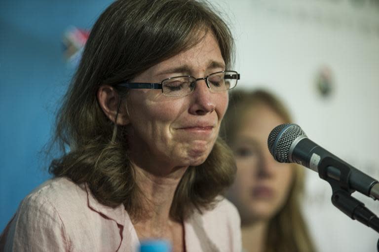 The widow of slain South African hostage Pierre Korkie, Yolanda Korkie, reacts during a press conference on December 9, 2014