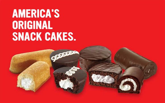 Twinkies, Ding Dongs, Ho-Hos, and cupcakes on a red background with 