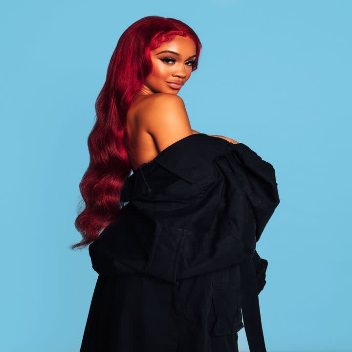 Saweetie looks over her shoulder as she poses for a photo