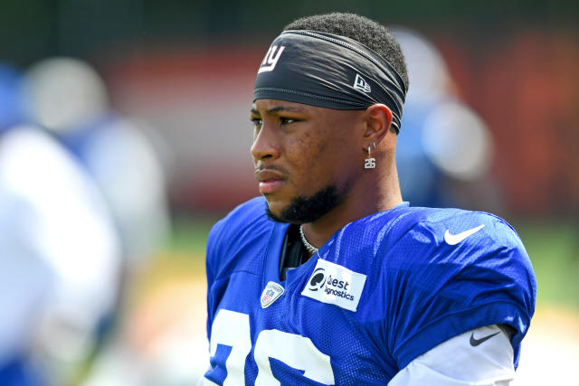 Giants training camp opens to little drama as Saquon Barkley ends