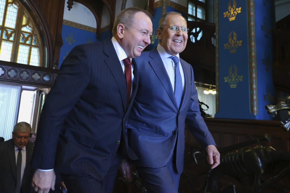 FILE - In this photo released by Russian Foreign Ministry Press Service, Belarusian Foreign minister Vladimir Makei, left, and Russian Foreign Minister Sergey Lavrov smile as they arrive for the talks in Moscow, Russia, Friday, June 18, 2021. Belarusian Foreign Minister Vladimir Makei, a close ally of authoritarian President Alexander Lukashenko, has died at age 64, the state news agency Belta reported Saturday, Nov. 26, 2022. No cause of death was stated. (Russian Foreign Ministry Press Service via AP, File)