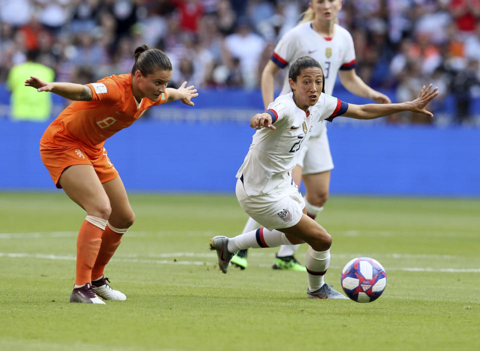 United States' Christen Press, right, is challenged by Netherlands' Sherida Spitse during the Women's World Cup final soccer match between US and The Netherlands at the Stade de Lyon in Decines, outside Lyon, France, Sunday, July 7, 2019. (AP Photo/David Vincent)