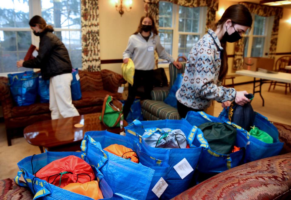 Teens Sohraya Keltner, 15, left, Amalia Holbrook, 14, and Taylor Farage, 16, right, assemble personal and winter kits for those in need at Bay Shore Lutheran Church, 1200 E. Hampton Road, Whitefish Bay, as part of the Day of Service on Martin Luther King Jr. day on Monday, Jan. 17, 2022. Forty volunteers participated in making 75 personal kits, 25 winter kits and 800 sandwiches. The personal kits that included hygiene items will go to the Hope Center, personal kits will go to the Milwaukee Christen Center and the sandwiches will be delivered to Just One More Ministry in Glendale.