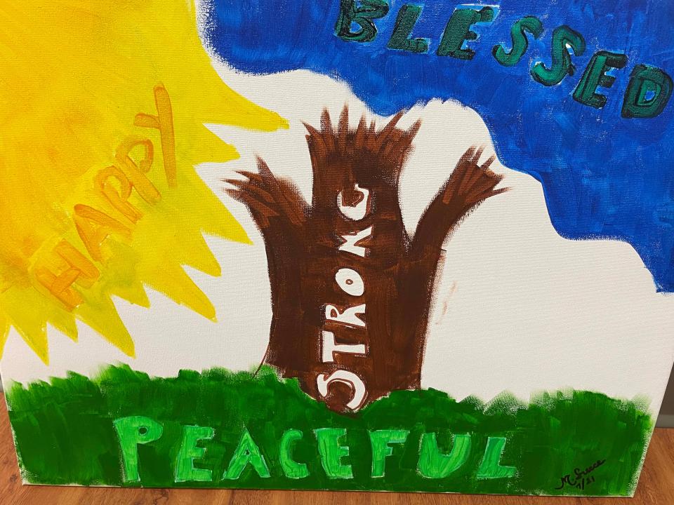 The community room is decorated by inspirational paintings done by clients at Fig Tree, a homeless community outreach program sponsored by Cokesbury United Methodist Church, on June 1, 2022.