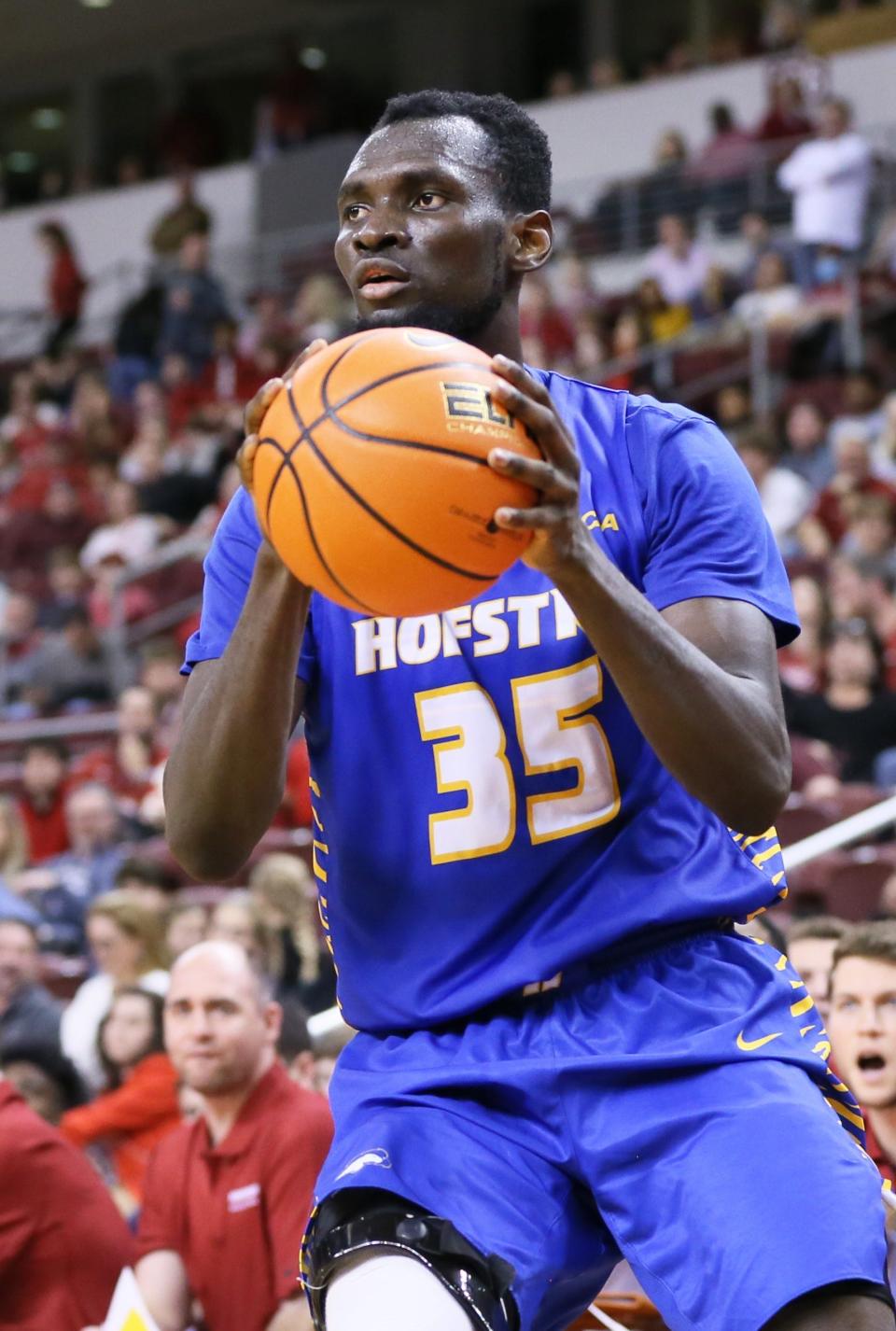 Kansas State's basketball roster finally reached double digits Friday with the signing of Hofstra graduate transfer Abayomi Iyiola.
