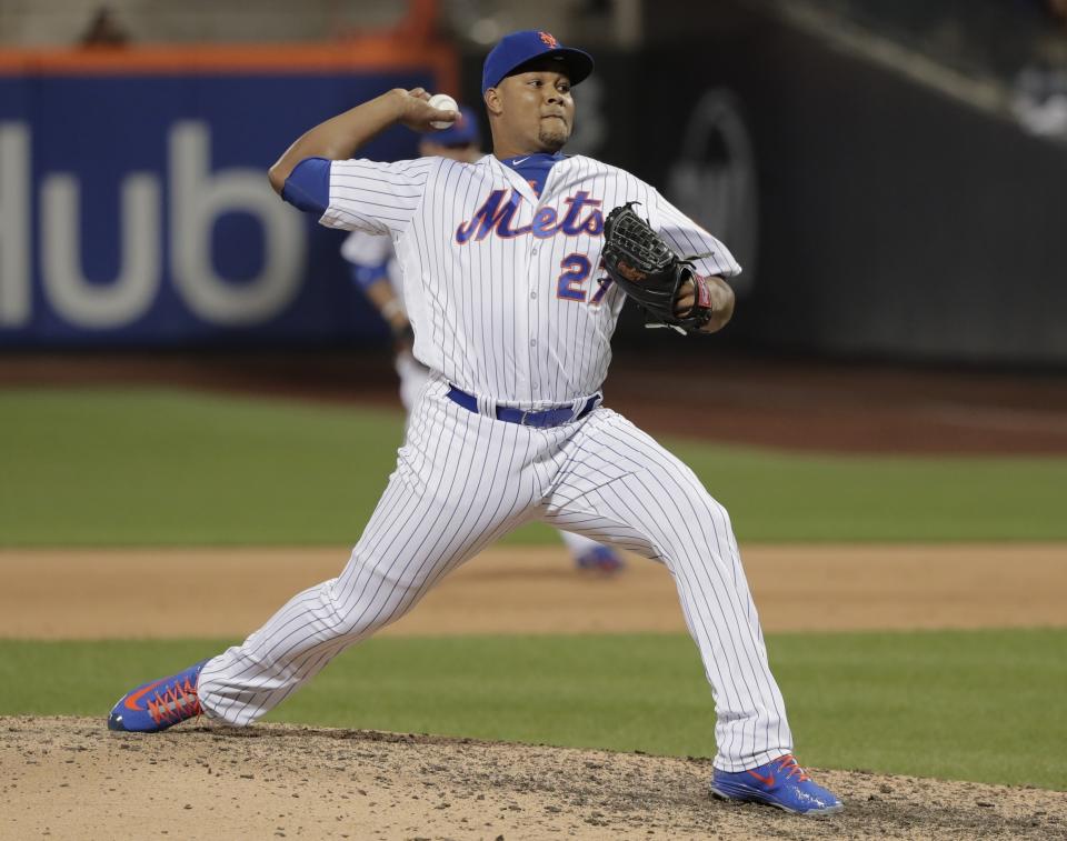 FILE - In this May 18, 2018, file photo, New York Mets pitcher Jeurys Familia (27) delivers against the Arizona Diamondbacks during the ninth inning of a baseball game in New York. The revamped Mets bullpen is set to include a very familiar face — longtime reliever Jeurys Familia. Familia reached a free-agent deal with the team that traded him away last summer, a person with knowledge of the contract told The Associated Press late Wednesday night, Dec. 12, 2018. The person spoke on condition of anonymity at the winter meetings because the team had not yet announced the move. Familia likely must pass a physical for the contract to be finalized. (AP Photo/Julie Jacobson, File)