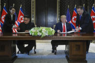 <p>North Korea leader Kim Jong Un and U.S. President Donald Trump prepare to sign a document at the Capella resort on Sentosa Island Tuesday, June 12, 2018 in Singapore. (AP Photo/Evan Vucci) </p>
