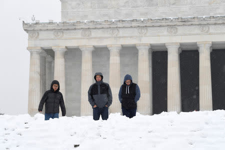 Visitors make their way through snow left by Winter Storm Gia, which paralyzed much of the nation's midsection, at the Lincoln Memorial, in Washington, D.C., U.S., January 13, 2019. REUTERS/Mike Theiler