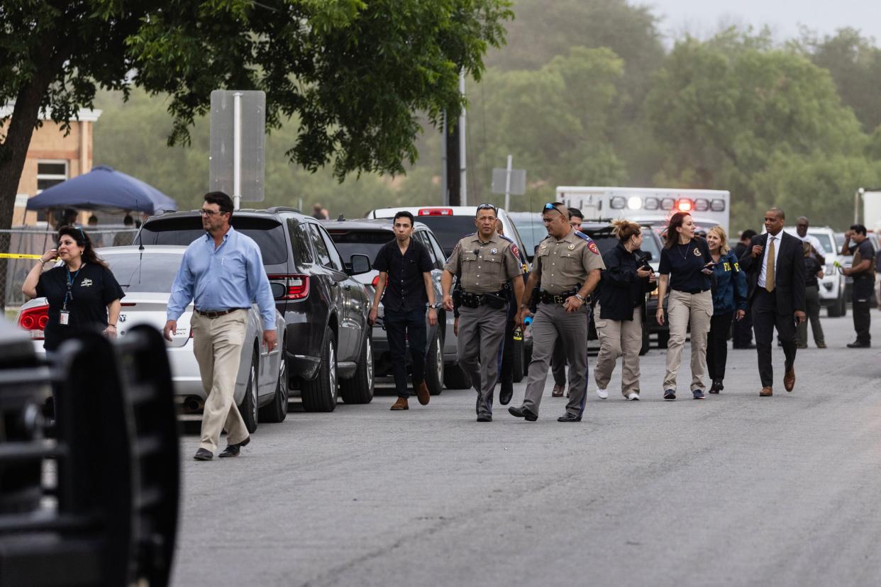 Law enforcement work the scene after a mass shooting at Robb Elementary School where 21 people, including 19 children, were killed on May 24, 2022, in Uvalde, Texas. The suspected gunman, identified as 18-year-old Salvador Ramos, was reportedly killed by law enforcement.