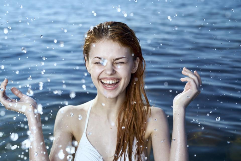 Woman splashing in ocean