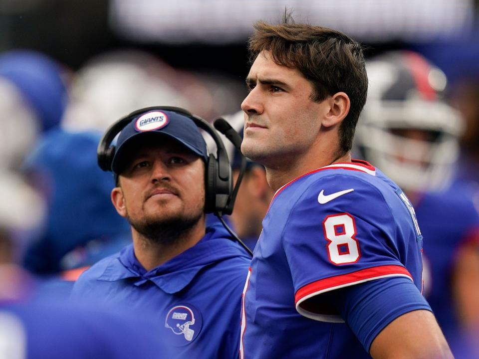 Daniel Jones watches a play from the sidelines during a game against the Chicago Bears.
