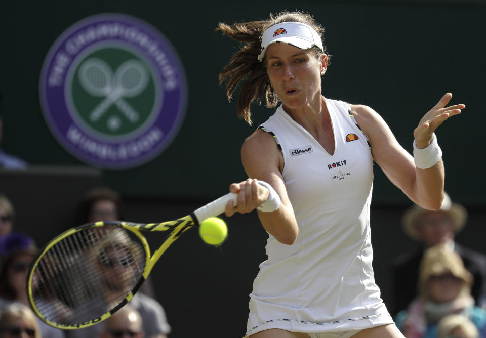 Britain's Johanna Konta returns the ball to Czech Republic's Barbora Strycova during a women's quarterfinal match on day eight of the Wimbledon Tennis Championships in London, Tuesday, July 9, 2019. (AP Photo/Kirsty Wigglesworth)