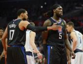 February 25, 2019; Los Angeles, CA, USA; Los Angeles Clippers guard Garrett Temple (17) reacts with forward Montrezl Harrell (5) after drawing a foul against the Dallas Mavericks during the second half at Staples Center. Mandatory Credit: Gary A. Vasquez-USA TODAY Sports