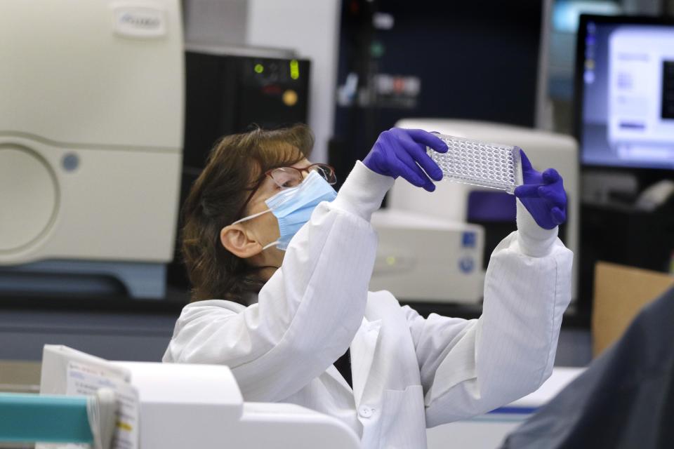 Collected swab samples are logged in, processed, and labeled as one part of the testing procedure at the R.I. Department of Health laboratory.