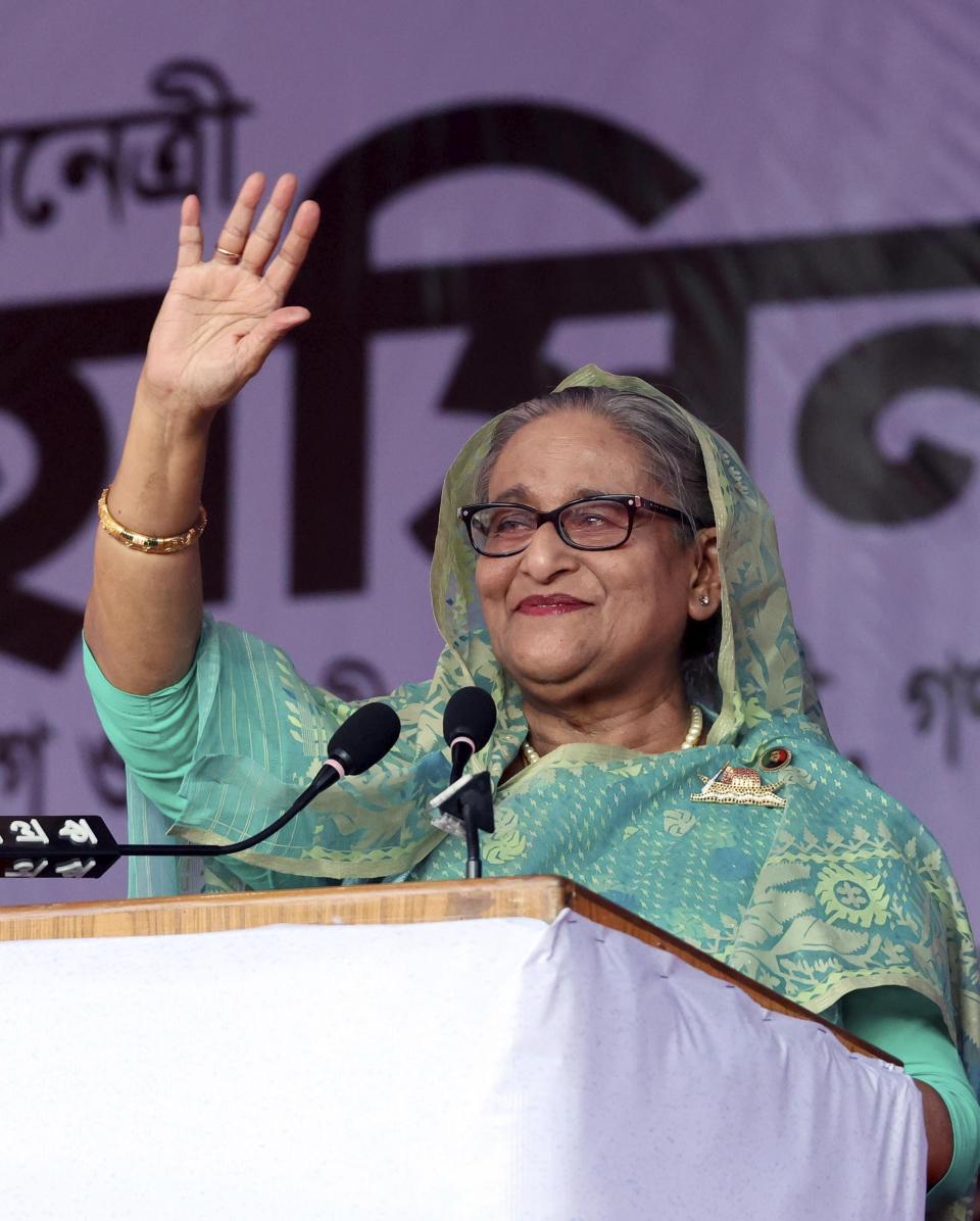 Bangladesh's Prime Minister Sheikh Hasina waves to the gathering during an election campaign rally for her ruling Awami League party, ahead of the upcoming national elections, in Sylhet, Bangladesh, Wednesday, Dec. 20, 2023. The country is gearing up for the Jan. 7 election, but opposition Bangladesh Nationalist Party led by former Prime Minister Khaleda Zia repeated its call on Wednesday to boycott the election. (AP Photo/Saiful Islam Kallal)