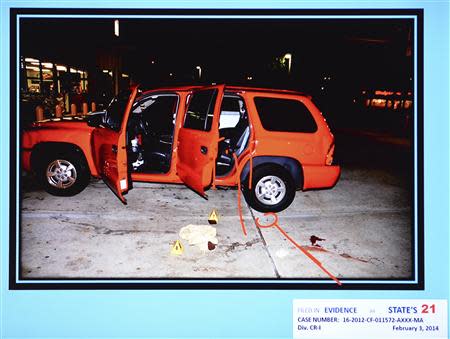 A state evidence photo presented February 7, 2014 during the murder trial of Michael Dunn in Jacksonville, Florida, shows the red Durango SUV where Jordan Davis was seated when he was shot at a gas station during an altercation. REUTERS/Bob Mack/The Florida Times-Union/Pool