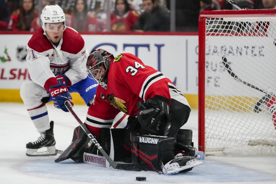 Chicago Blackhawks goaltender Petr Mrazek makes a save against the Montreal Canadiens center Jake Evans during the first period of an NHL hockey game Friday, Dec. 22, 2023, in Chicago. (AP Photo/Erin Hooley)