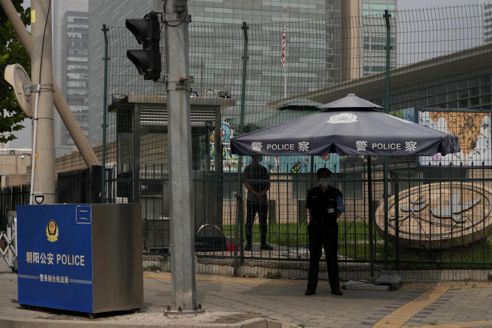 Chinese security personnel guard the U.S. embassy in Beijing, Monday, Aug. 1, 2022. U.S. House Speaker Nancy Pelosi has arrived in Singapore, kicking off her Asian tour as questions swirled over a possible stop in Taiwan that has fueled tension with Beijing. (AP Photo/Ng Han Guan)