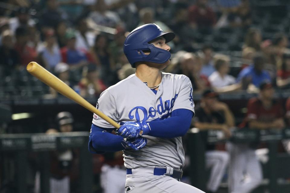 Los Angeles Dodgers' Joc Pederson watches the flight of his home run against the Arizona Diamondbacks during the 11th inning of a baseball game Sunday, Sept. 1, 2019, in Phoenix. (AP Photo/Ross D. Franklin)