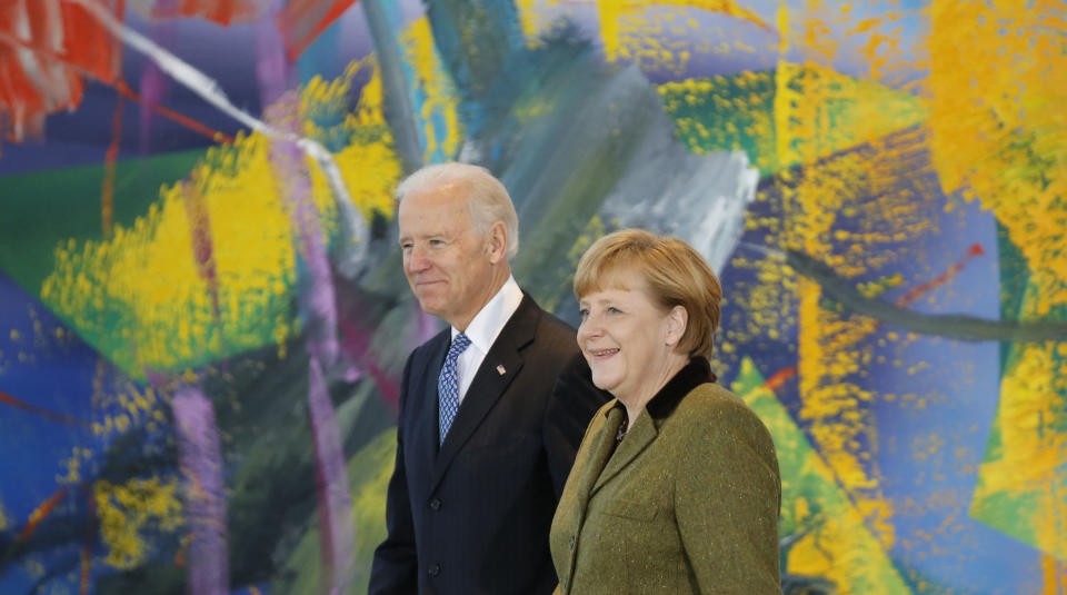 German Chancellor Angela Merkel and U.S. Vice President Joe Biden arrive to make a statement to the media before talks in Berlin February 1, 2013. REUTERS/Tobias Schwarz (GERMANY - Tags: POLITICS)