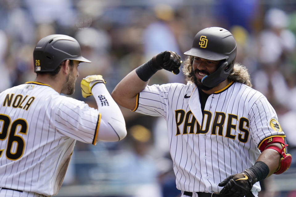 San Diego Padres' Jorge Alfaro, right, is greeted by Austin Nola after hitting a home run against the Arizona Diamonbacks during the sixth inning of a baseball game Wednesday, June 22, 2022, in San Diego. (AP Photo/Gregory Bull)