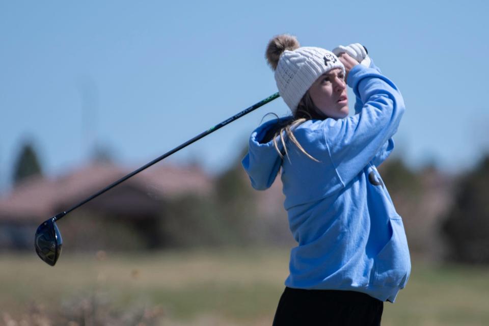 Pueblo West's Gianna Nardini tracks her tee shot on the 10th hole during the Centennial girls golf tournament at Walking Stick Golf Course on Wednesday, April 6, 2022.