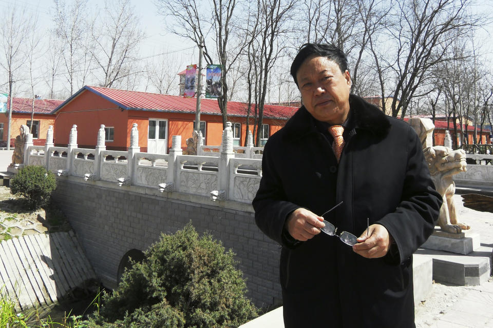 In this April 2, 2010 photo provided by the Legal Team of Dawu Group, Sun Dawu stands in Baoding in northern China's Hebei Province. A prominent Chinese pig farmer who was detained after praising lawyers during a crackdown on legal activists by President Xi Jinping's government has been se,ntenced to 18 years in prison on charges of organizing an attack on officials and other offenses. (Legal Team of Dawu Group via AP)