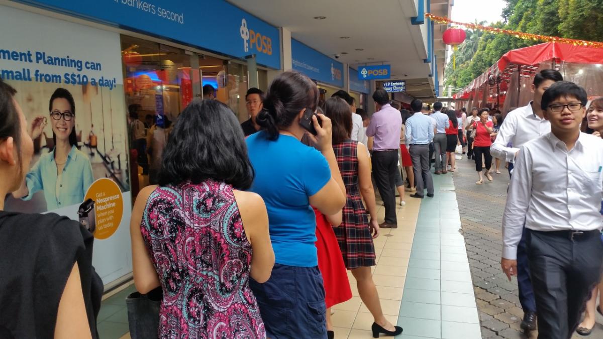 Bank depositors form long queues on 'auspicious' day ahead of