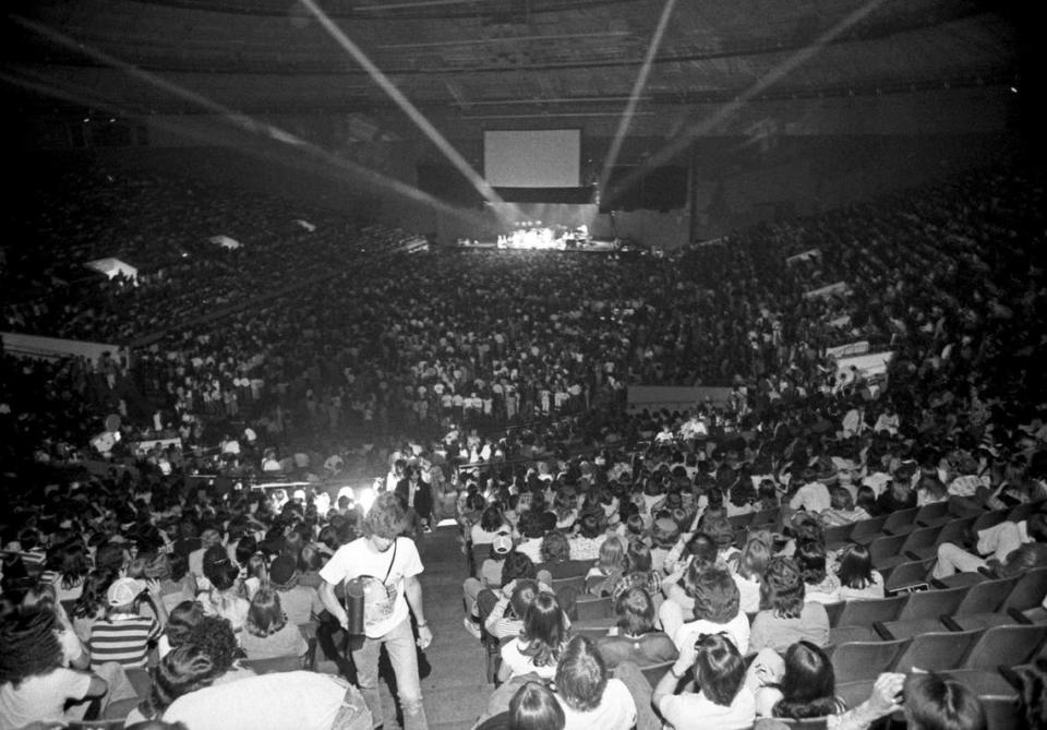 This view of the crowd in attendance for Paul McCartney and Wings on May 3, 1976 at the Tarrant County Convention Center shows the stage on the opposite end of the arena, in front of a sea of floor seating. The show was the “Wings Over America” tour opener and the first concert McCartney has performed in North America since The Beatles final tour in the summer of 1966.